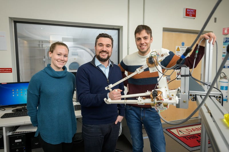 Prof. Fabrizio Sergi (center) is joined by Andria Farrens (left) and Andrea Zonnino, both of whom are doctoral students in biomedical engineering.